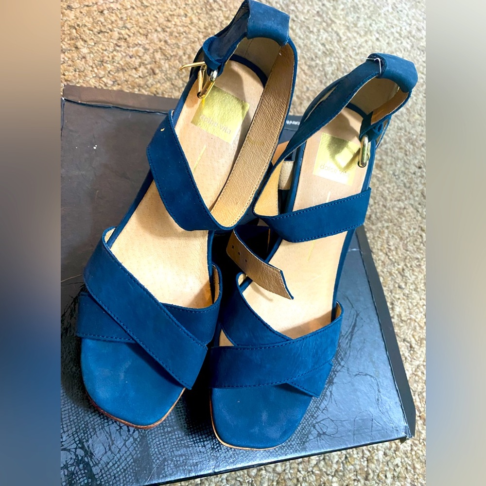 Dolce vita wedge heels in the color blue size 8.5. Slightly worn.